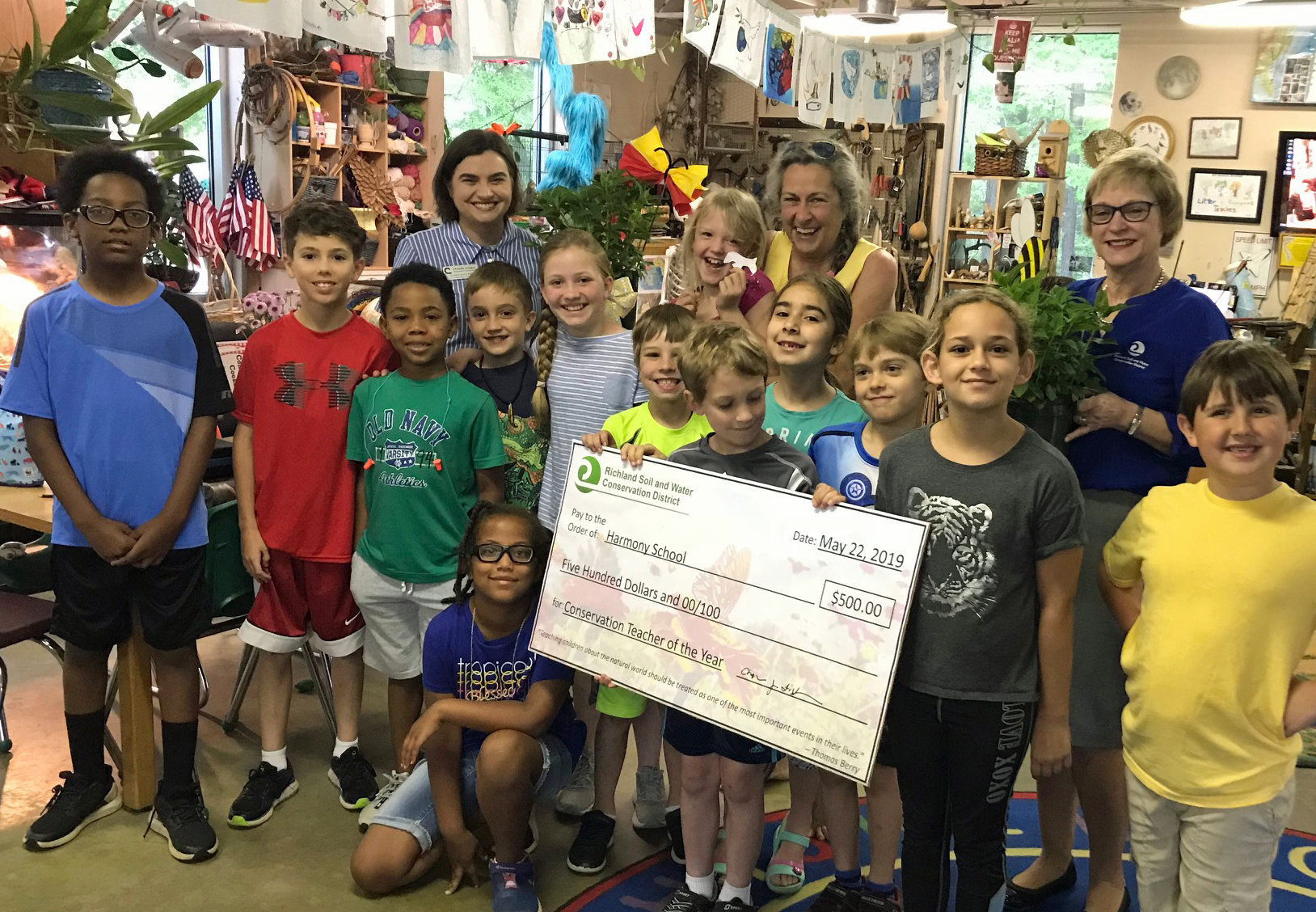 Jennifer Mancke and Harmony School students receive surprise award