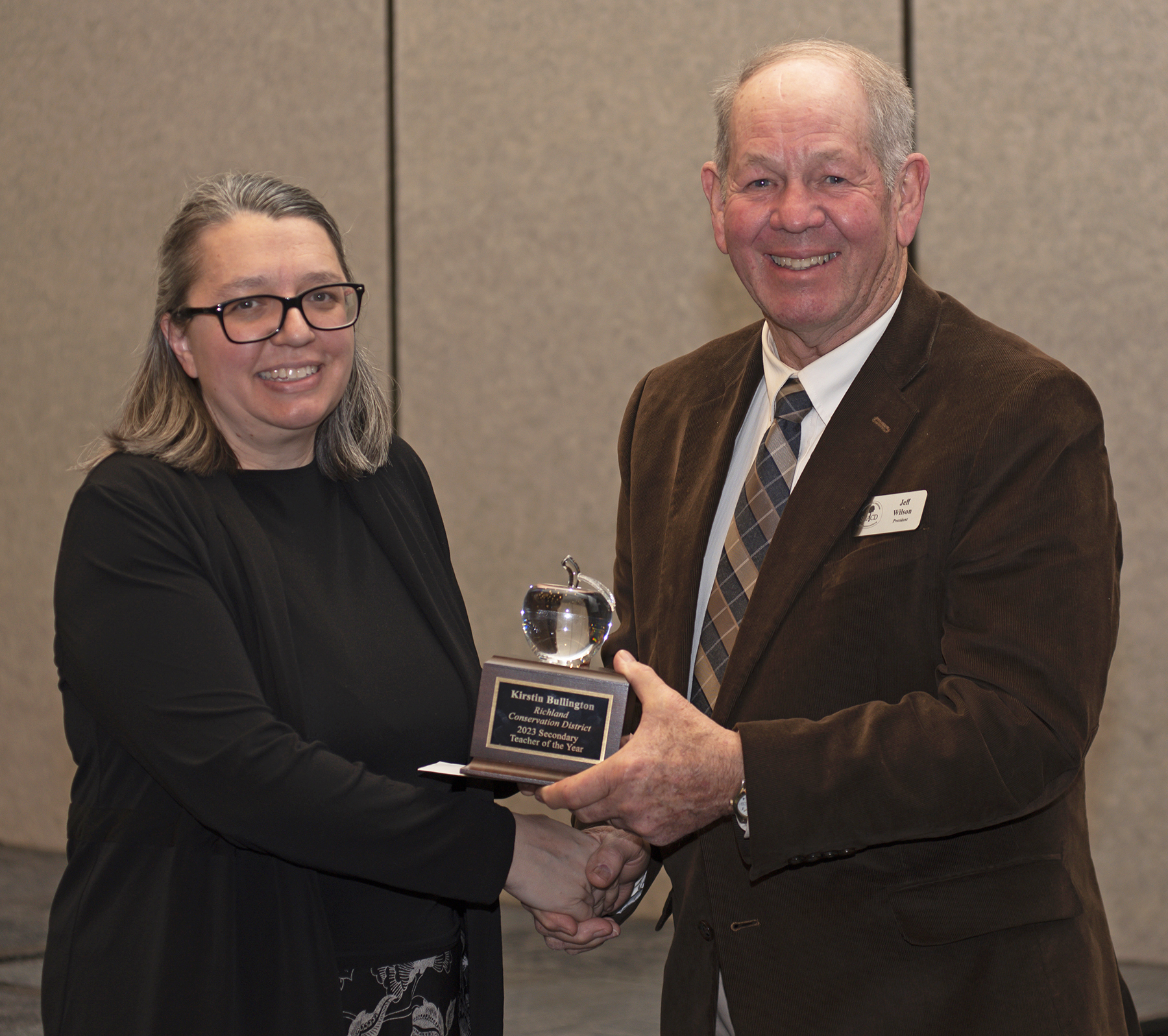 Kirstin Bullington, an instructor at Richland Two Institute of Innovation, receives the 2023 Conservation Teacher of the Year award (Secondary) from Jeff Wilson, president of the S.C. Association of Conservation Districts