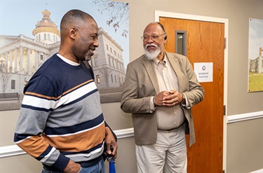 Two event attendees networking at Beyond the Bid event