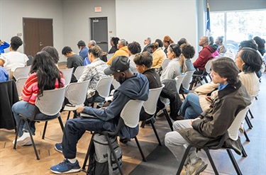audience listens at an OSBO event