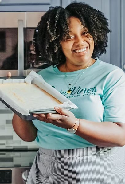 a woman holds Carrie Vines homemade treats